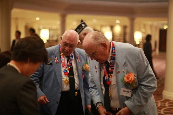 Presenting the Plaque of Appreciation to the Korean War Veterans of the 142nd Regiment